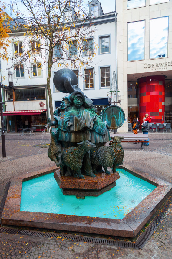 Famous sheep fountain (Hämmelsmarsch) by Wil Lofy in the city center. The central figure is a self-portrait of the artist who has died at the age of 84. Shutterstock