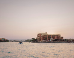 Approach by sea to the, recently photographed in December 2025, to the  Three Corners Ocean View Hotel, El Gouna, Egypt . This late 90’s renovation of key hotel areas was approached not as a problem to solve, but as structure with a memory.  Simon Menges & Nino Tugushi