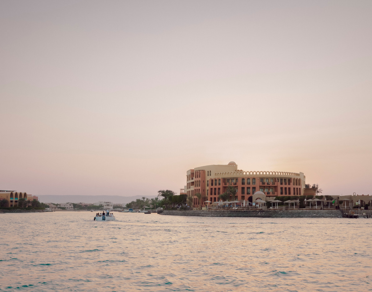 Approach by sea to the, recently photographed in December 2025, to the  Three Corners Ocean View Hotel, El Gouna, Egypt . This late 90’s renovation of key hotel areas was approached not as a problem to solve, but as structure with a memory.  Simon Menges & Nino Tugushi