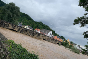 A view taken from the Luxembourg side of the Echternach Bridge and the rising Sauer, 15 July 2021. Photo: Lisa Grisius