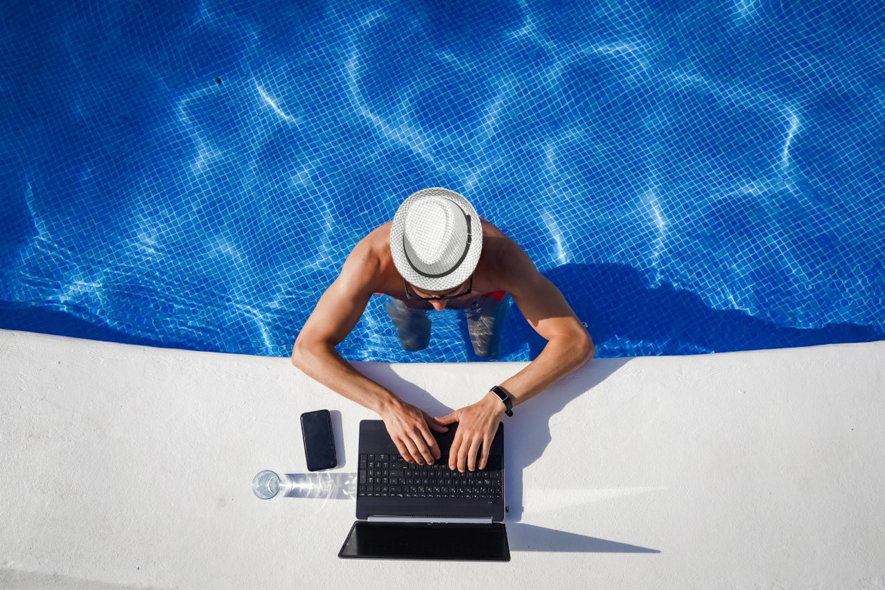 On paper, there’s nothing to stop you from teleworking in the place you’ve been on holiday... But it's best to make sure you've got your employer's approval. Photo: Shutterstock