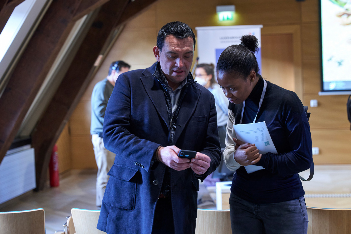 Photos from the first day of the event showing attendees/speakers at the 2022 European Microfinance Week e-MFP