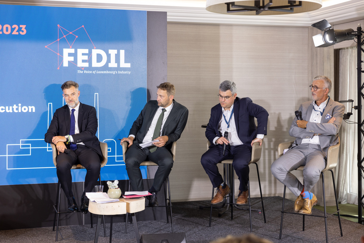 (l-r) Franz Fayot (LSAP), minister of the economy; Christophe Hansen, member of the European Parliament; Pierre Laffont, director, EU Affairs, France Industrie; Georges Rassel, vice-president, Fedil. Photo: Romain Gamba / Maison Moderne