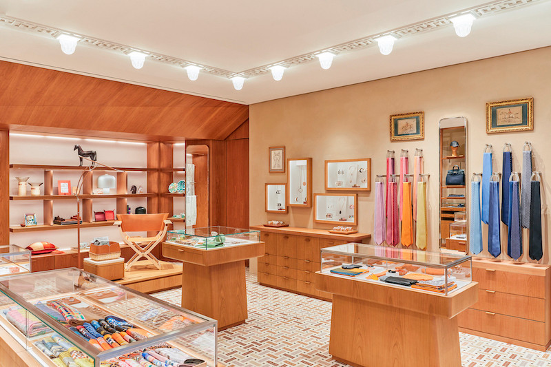 The store is fitted out in natural wood and stone and the traditional Hermès mosaic flooring Timothée Chambovet
