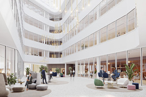 View of the atrium in the office building. Illustration: architectesassoc+