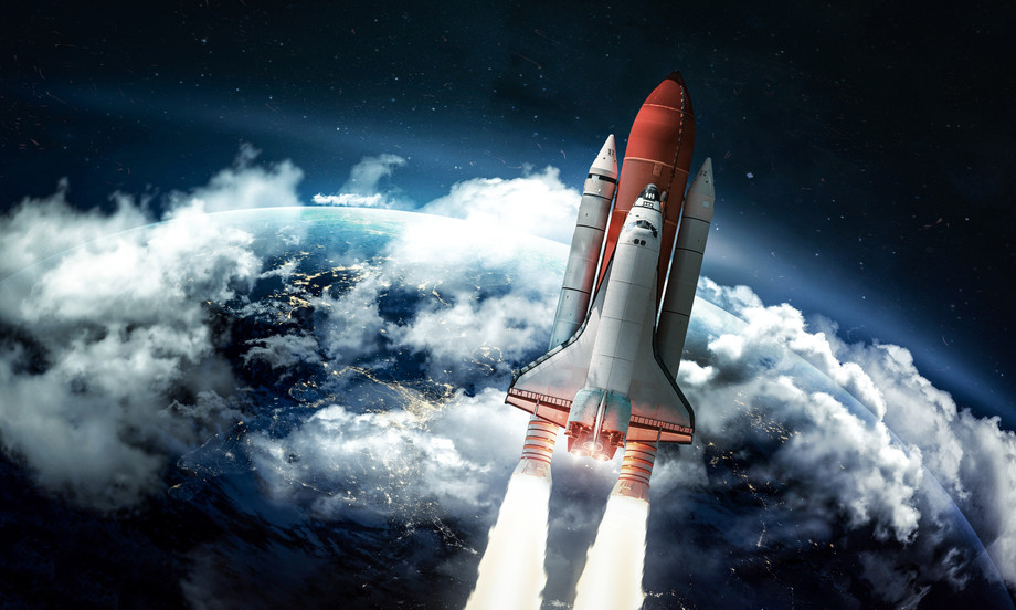 Space shuttle in the space near Earth. Elements of this image furnished by NASA Dima Zel/Shutterstock.