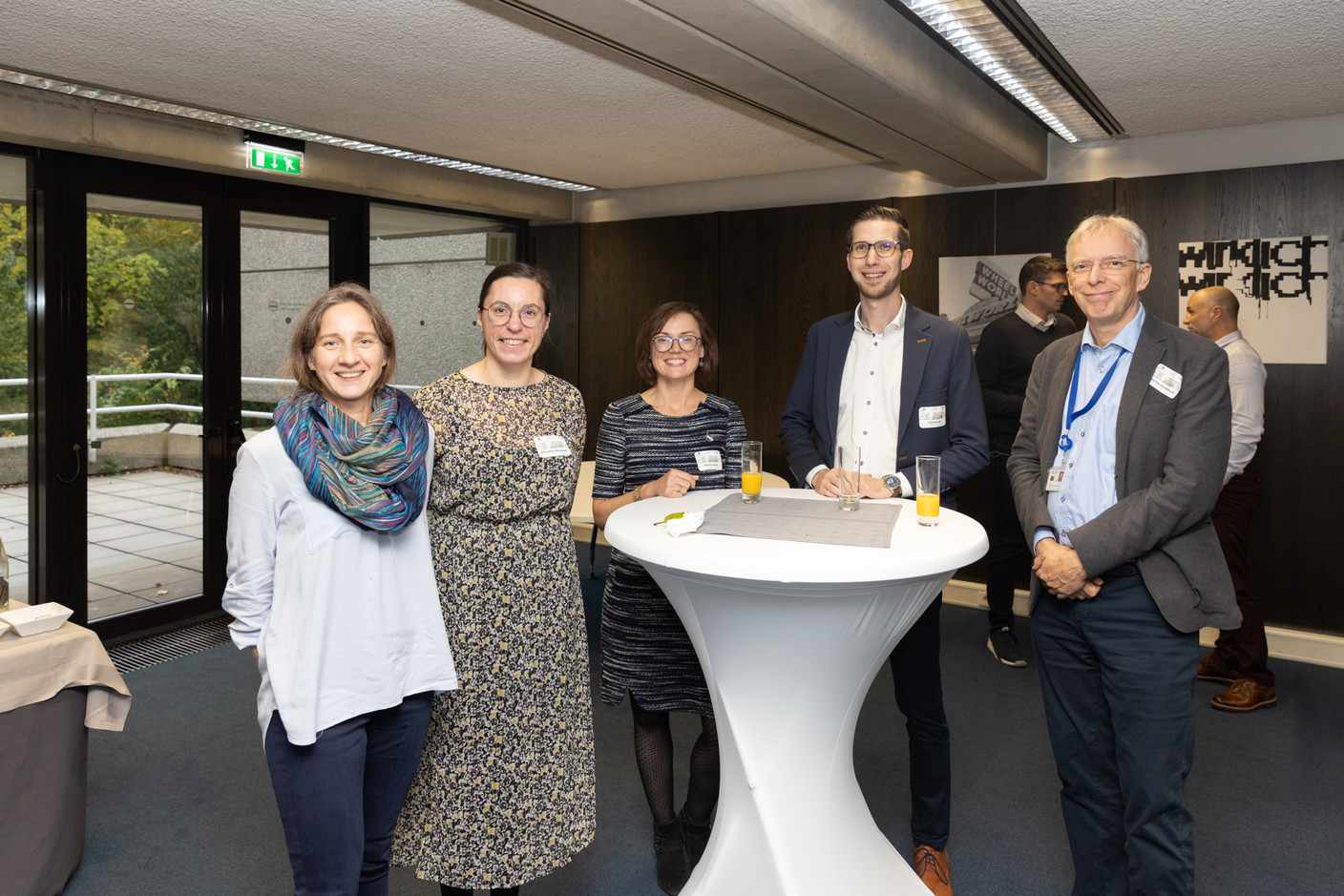 Anne-Marie Reckinger (second from left), Myriam Jacoby (centre) and Pol Henrotte (second from right) during the networking event at the ‘community disaster preparedness’ conference at EIB headquarters in Luxembourg on 26 October 2023. Photo: Romain Gamba / Maison Moderne