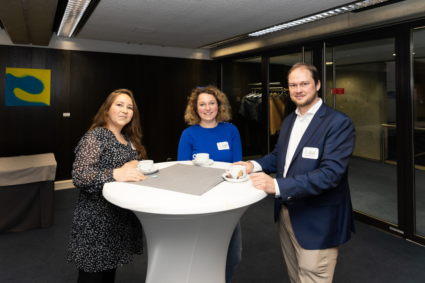 Lena Ziehmer (centre) and Benjamin Kaluza (right), during the networking event at the ‘community disaster preparedness’ conference at EIB headquarters in Luxembourg on 26 October 2023. Photo: Romain Gamba / Maison Moderne