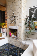 As was fashionable in the 1970s, the fireplace is placed in a recessed hearth set back from the level of the house. Photo: Eva Krins/Maison Moderne