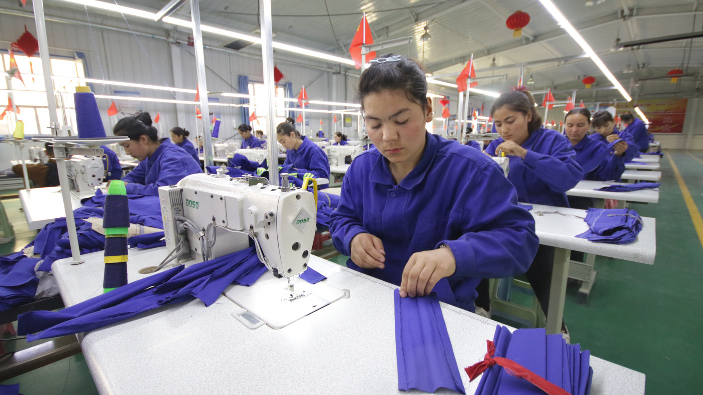 Uyghur women working in a cloth factory in Hotan county, Xinjiang province, China – April 2019. Copyright (c) 2020 Azamat Imanaliev/Shutterstock.
