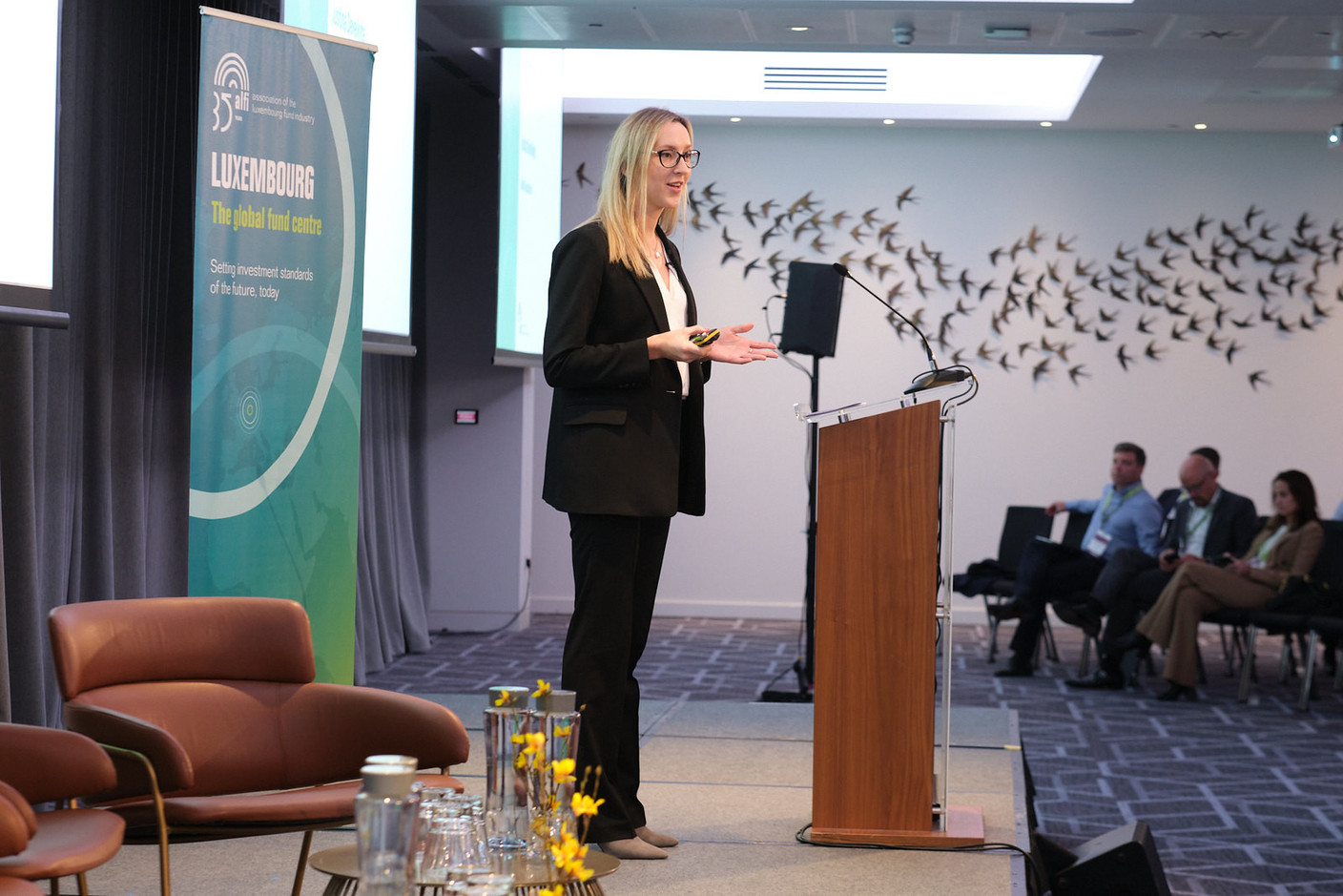 Justina Deveikyte, director of European institutional asset management research at Cerulli Associates, seen speaking during Alfi’s London conference, 19 October 2023. Photo: ALFI