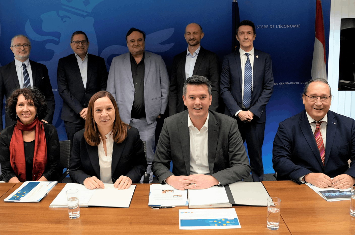 Seated, from left to right: Prof. Marie-Hélène Jobin, Vice Rector for Partnerships and International Relations - University of Luxembourg, Stéphanie Obertin, Minister for Research and Higher Education, Lex Delles, Minister of the Economy, SME, Energy and Tourism and Jean-Marie Reiff, Director ILNAS. Standing, from left to right:  Prof. Yves Le Traon, Director SnT, Léon Diederich, First Advisor to the Government, Ministry for Research and Higher Education, Prof. Pascal Bouvry, Dean of the Faculty of Science, Technology and Medicine (FSTM), Dr. Grégoire Danoy, Research scientist (FSTM) and Dr. Jean-Philippe Humbert, Deputy Director ILNAS (Photo: Ministry of the Economy, SME, Energy and Tourism)