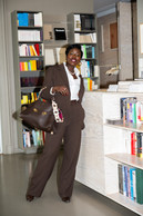 Business. Qustyle trouser suit, Zara boots, Ferragamo bag and Fendi shoulder strap. (Photo: Patricia Pitsch/Paperjam)