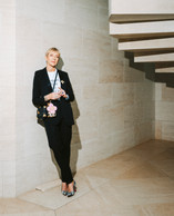 Day-to-day: a black Saint Laurent suit, Louboutin heels, a Vuitton bag. (Photo: Julian Pierrot/Paperjam)