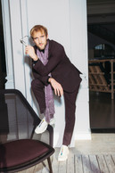 Back to business: world-conquering energy in a Hugo Boss suit and an Apostrophe’s scarf. Photo: Julian Pierrot/Paperjam
