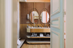 The bathrooms have been created in a spirit of continuity of style whilst giving a contemporary touch. Photo: Amaury Laparra