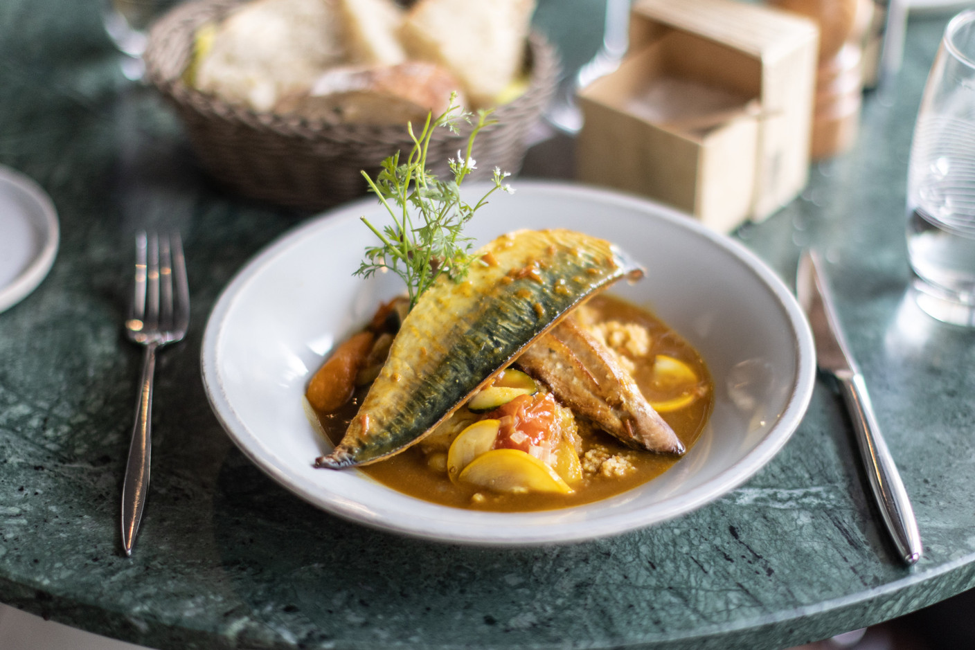 For lunch, smoked mackerel fillets on a bed of semolina and vegetables. Photo: Guy Wolff / Maison Moderne
