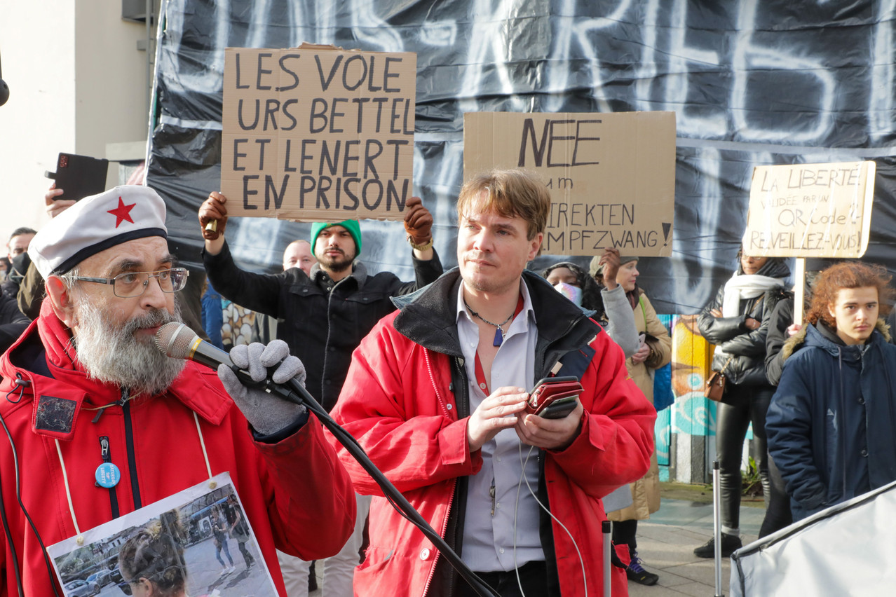 Photograph of anti-vaccine and covid measures figures during a protest in December 2021.  LUC DEFLORENNE