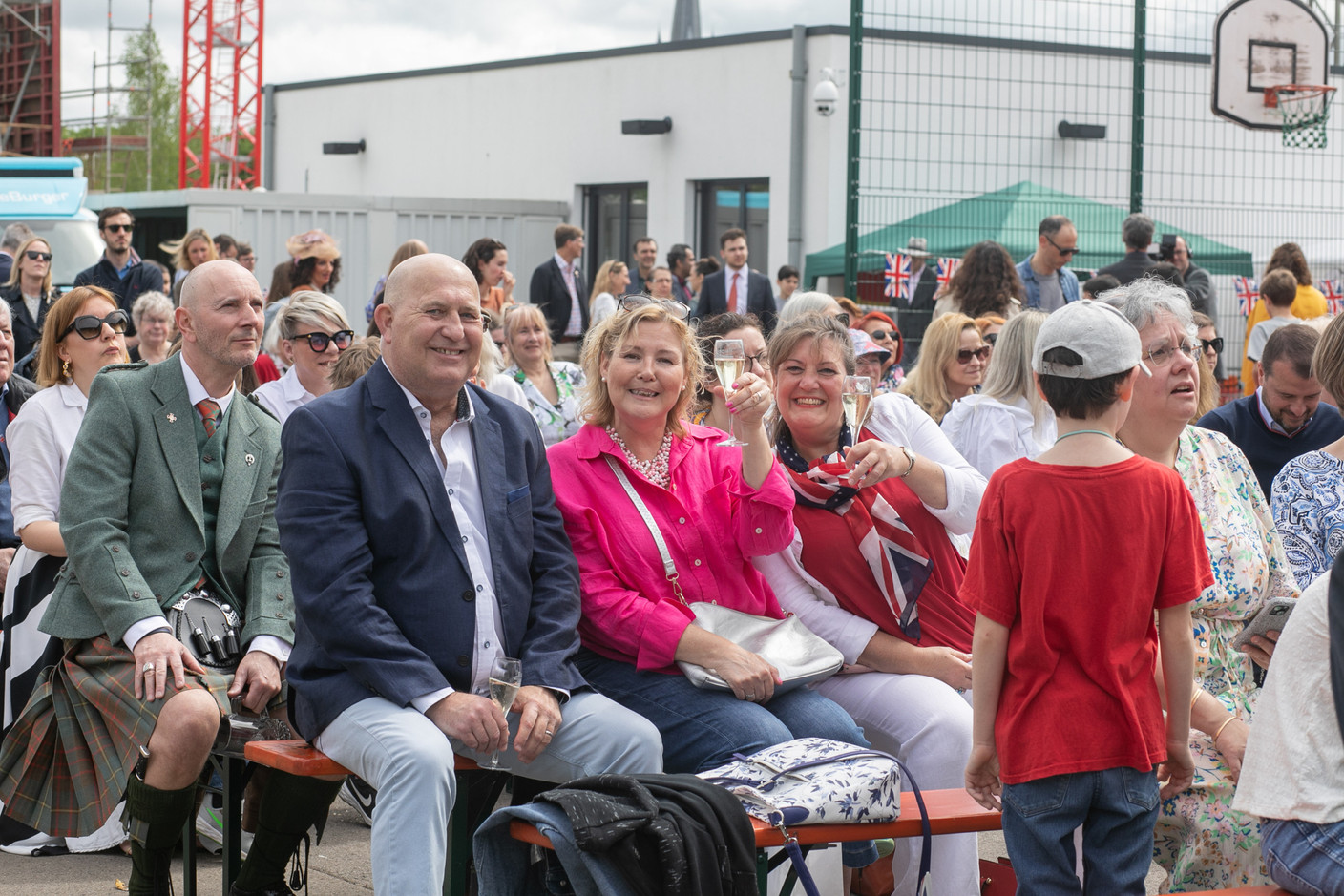 People attending an event at St George’s International School in Luxembourg on 6 May 2023 to celebrate the coronation of King Charles III and Queen Camilla. Photo: Matic Zorman / Maison Moderne