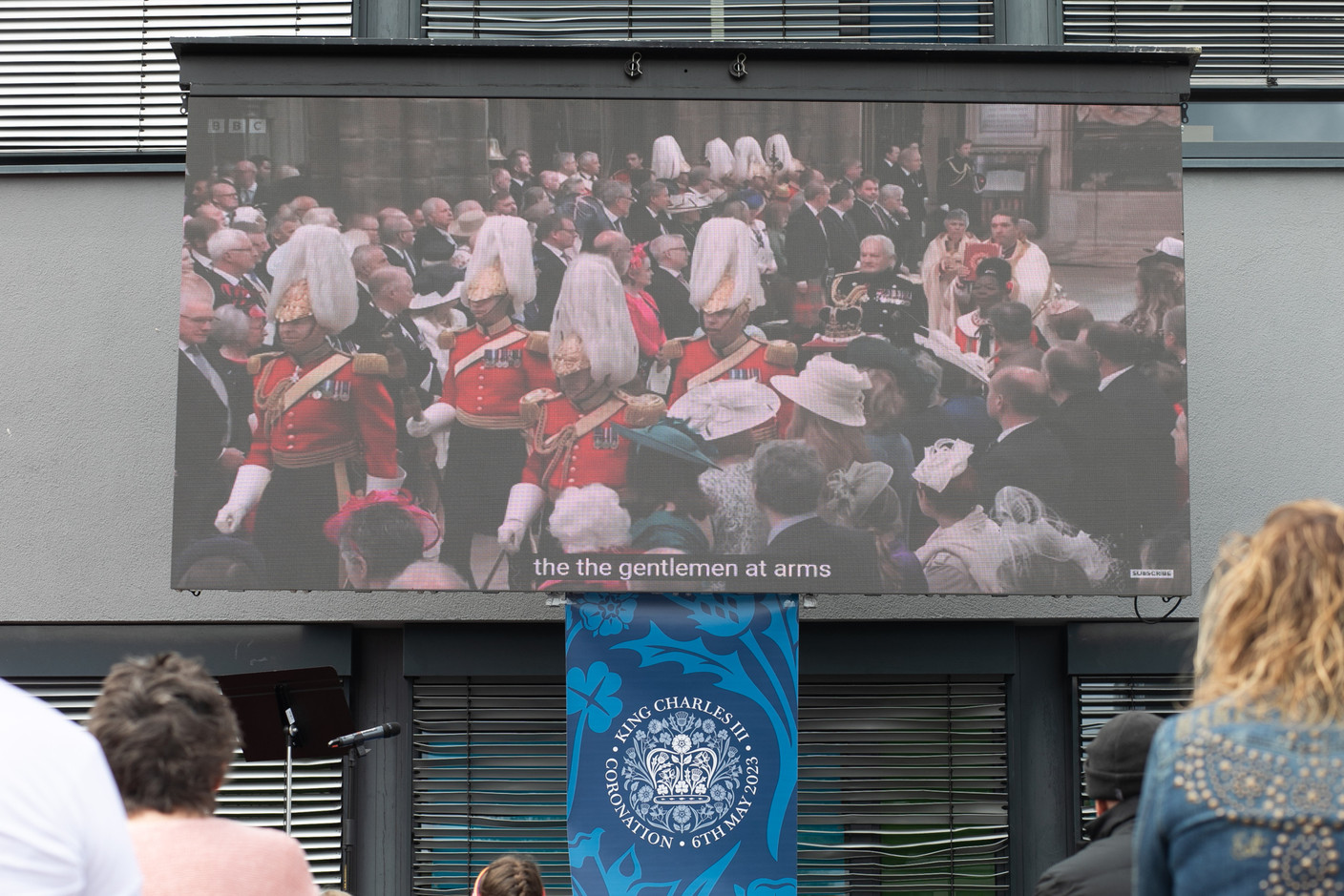 A big screen at St George’s International School showing the coronation service  of King Charles III and Queen Camilla taking place in London. Photo: Matic Zorman / Maison Moderne