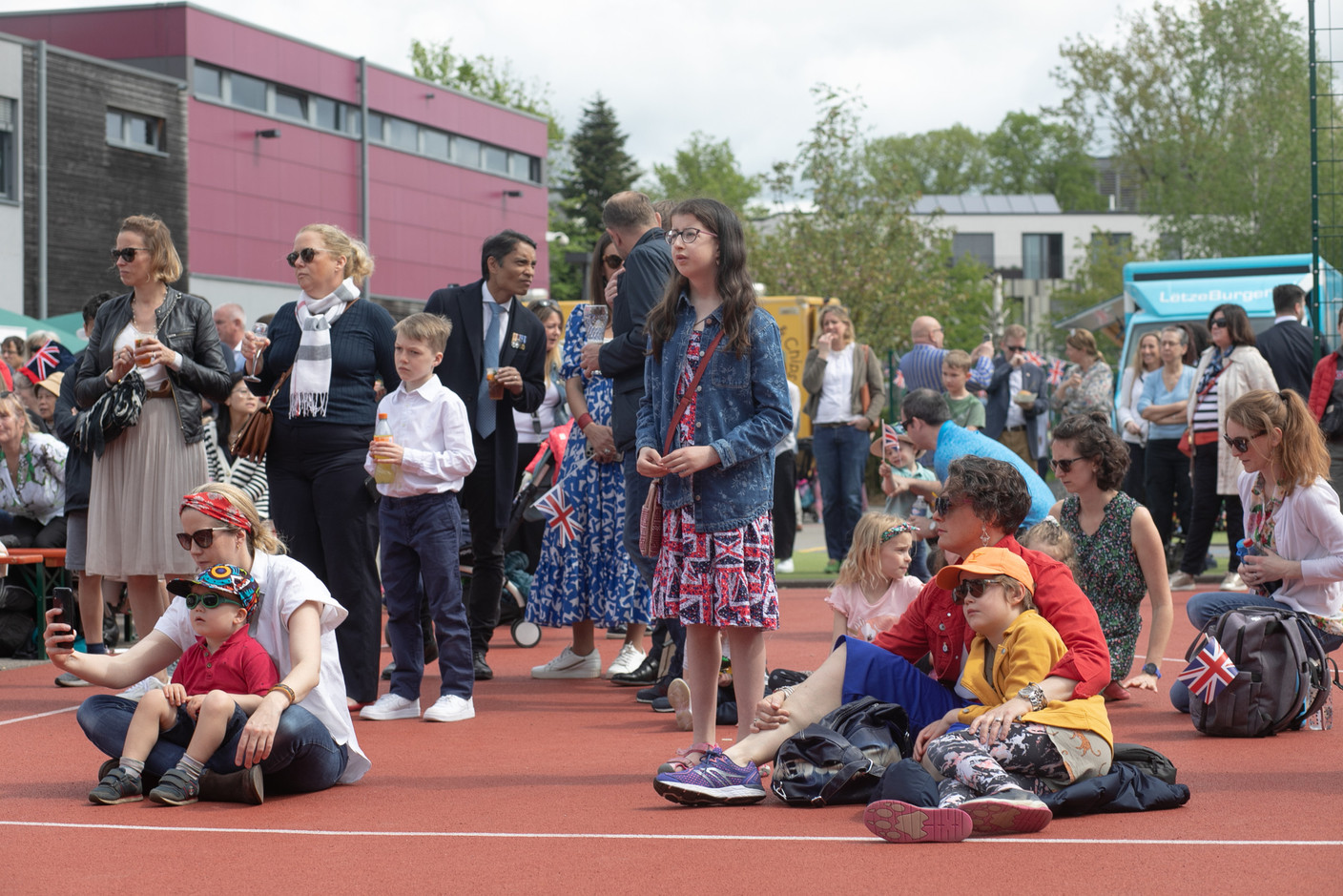 Attendees watching the coronation of King Charles III and Queen Camilla, which was shown on big screens at St George’s International School in Luxembourg on 6 May 2023. Photo: Matic Zorman / Maison Moderne