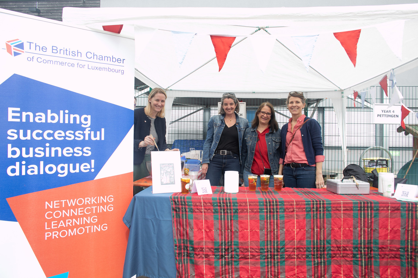 Sara Speed, Louise Edworthy and Rebecca Kellagher of the British Chamber of Commerce for Luxembourg, seen at the BCC stand during a viewing of the coronation service of King Charles III and Queen Camilla at St George’s International School in Luxembourg, 6 May 2023. Photo: Matic Zorman / Maison Moderne