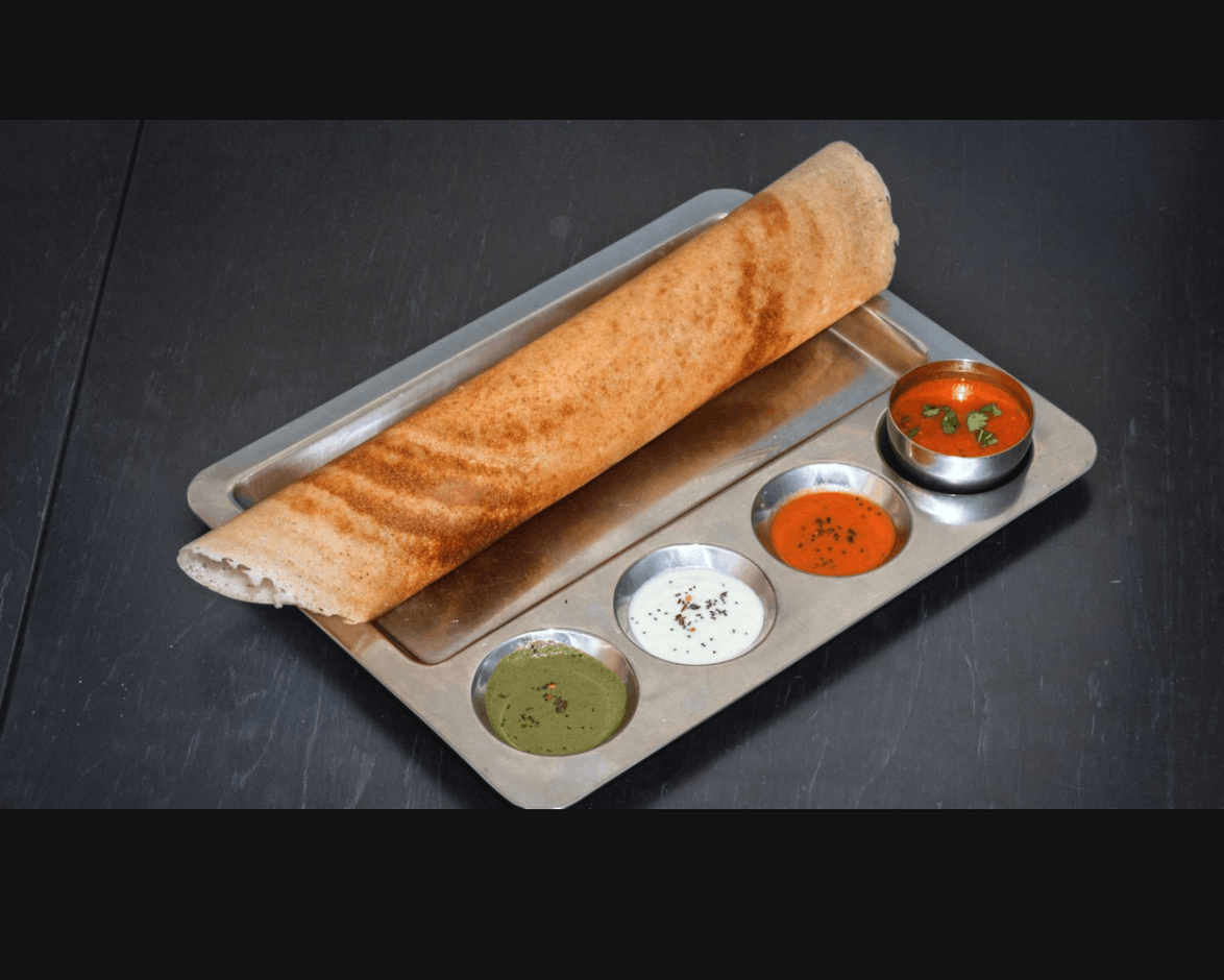 Sample of a dosas paired with several sauces Krishna Vilas
