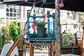 The Kufa Summer Bar is decorated with recycled furniture, lanterns and tables customised by local artists. Photo: Alborz Teymoorzadeh