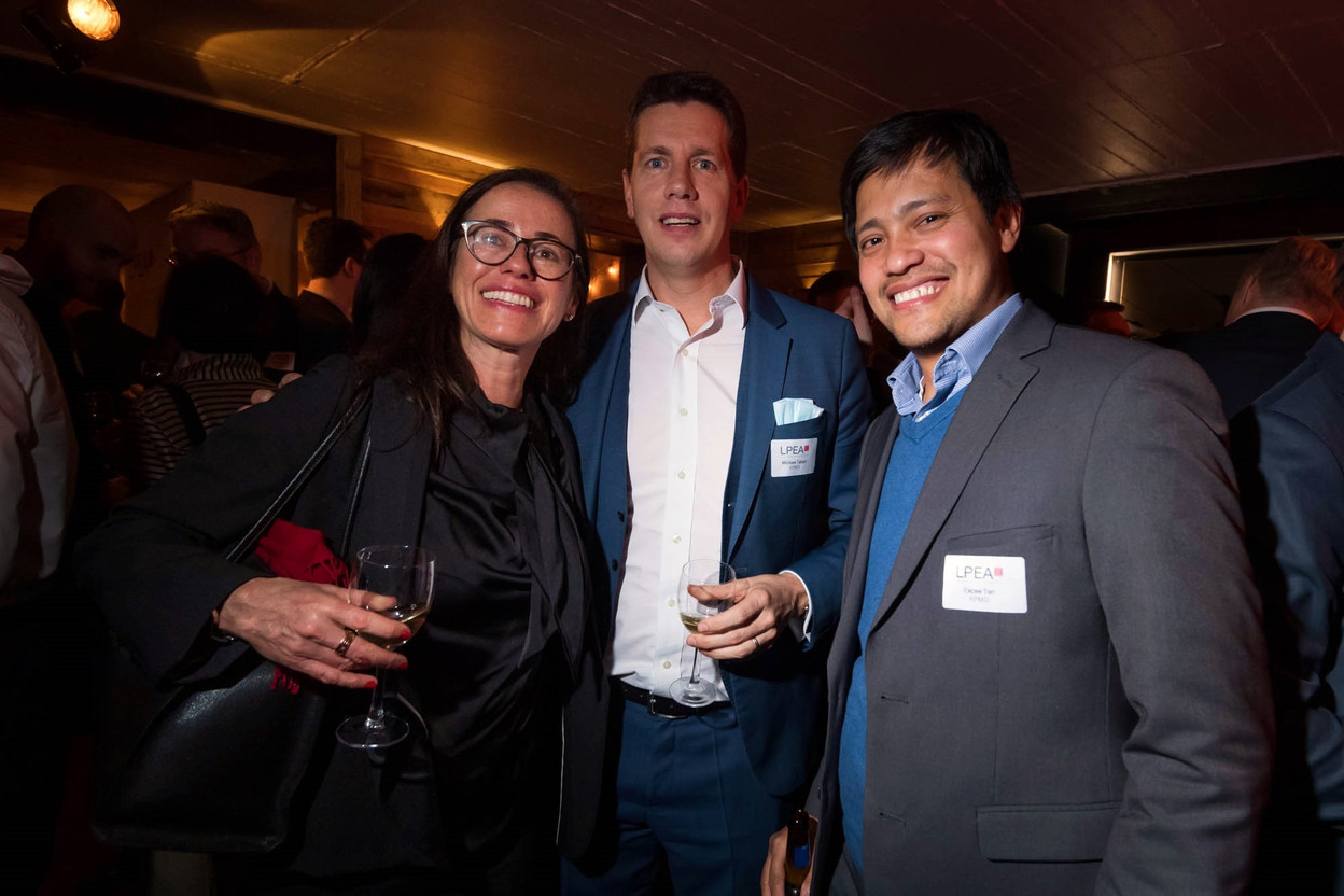 Alessia Lorenti of Edmond de Rothschild Asset Management (which sponsored the wine tasting), and Mickael Tabart and Excee Tan of KPMG are seen during the LPEA’s 2022 new year reception, 24 February 2022. Photo: Photo: LPEA/Nader Ghavami