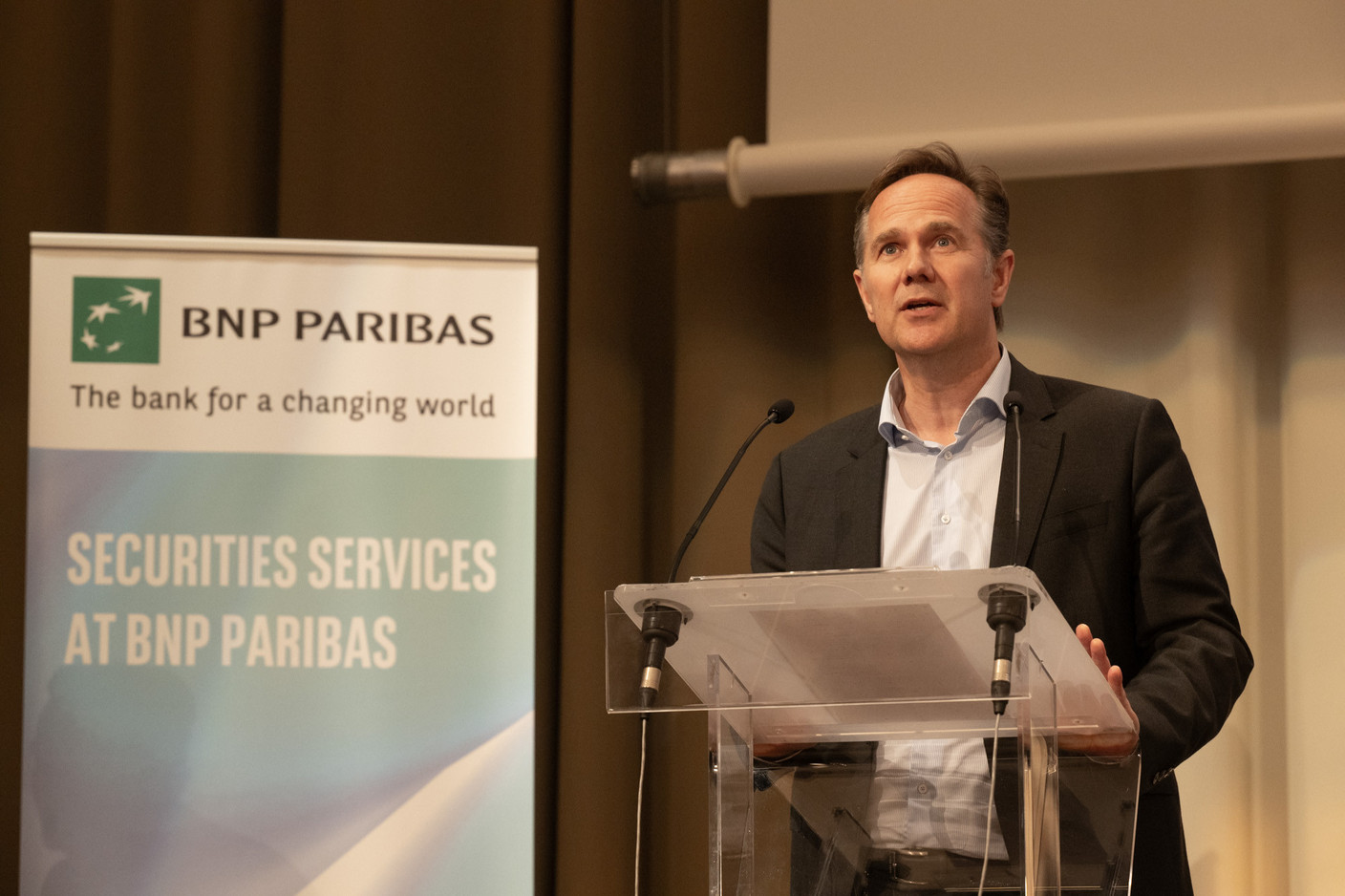 Robert Van Kerkhoff (managing director BNP Paribas Luxembourg) delivered introductory remarks at the LPEA’s annual general meeting, 11 June 2024.  Photo: Nader Ghavami/LPEA