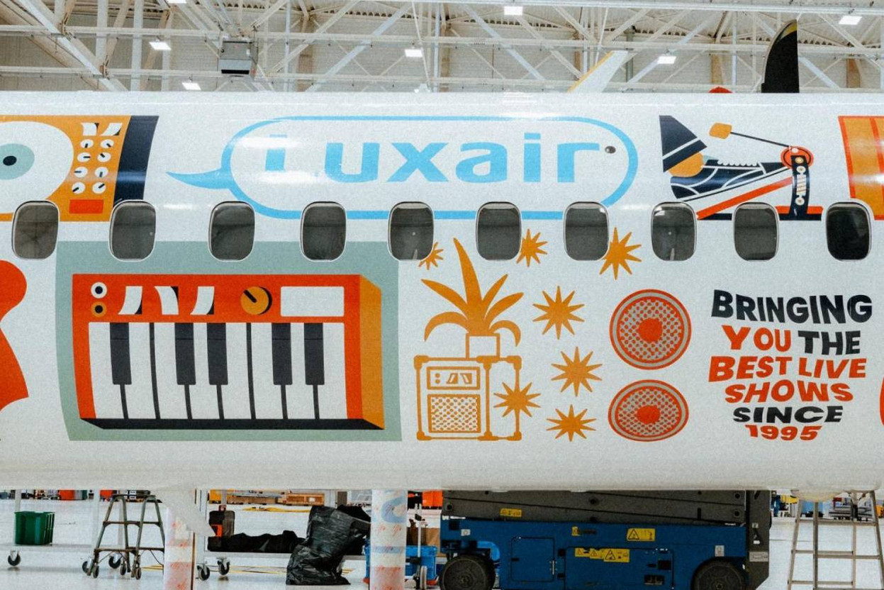 The plane--Luxair De Havilland Q400 (LX-LGN--features a bold livery, created by designer Loïc Lusnia and inspired by the world of den Atelier, with vibrant elements such as disco balls and Jack cables. Photo: Mick Drulang/den Atelier