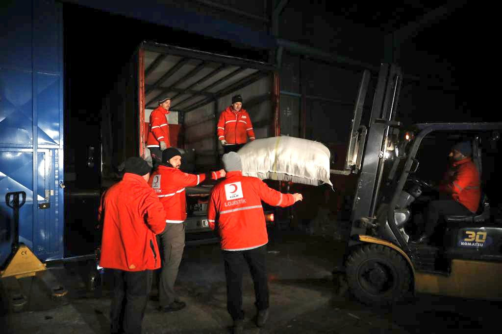 Aid materials at the Red Crescent’s Hatay Logistics Center are loaded onto vehicles before moving to the region where they will be distributed. Photo: Red Crescent/Twitter/6 February 2023.