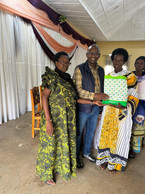 Abbe Pierre Habarurema, president of Luxembourg-based Femmes Développement, with members of a women’s cooperative that the association supports, seen during a trip to Rwanda in February and March 2024. Photo: Femmes Développement