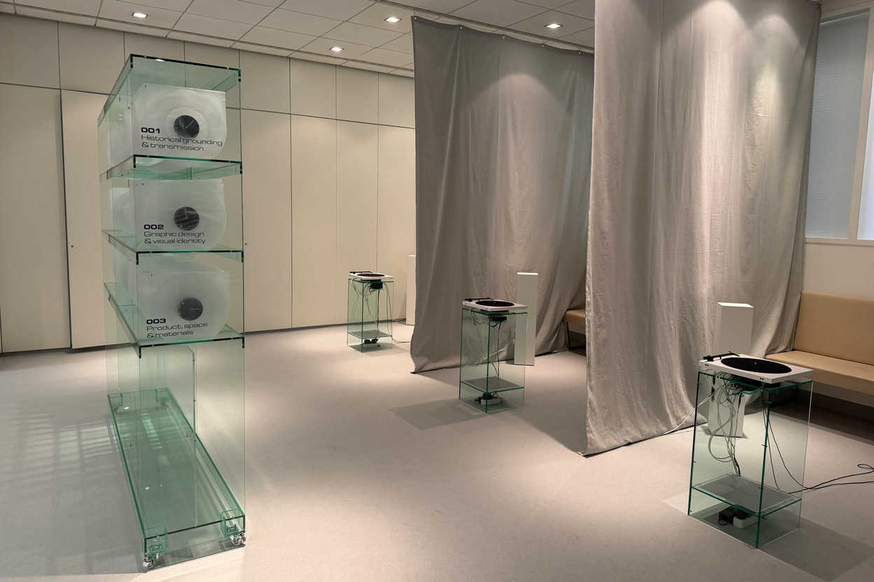 In the exhibition *Two-O-Eight: Designing Voices* at Festival Headquarters, the 28 podcasts pressed onto vinyl are arranged by theme in a glass cabinet, before being played on the turntables set up in the space. (Photo: Paperjam)