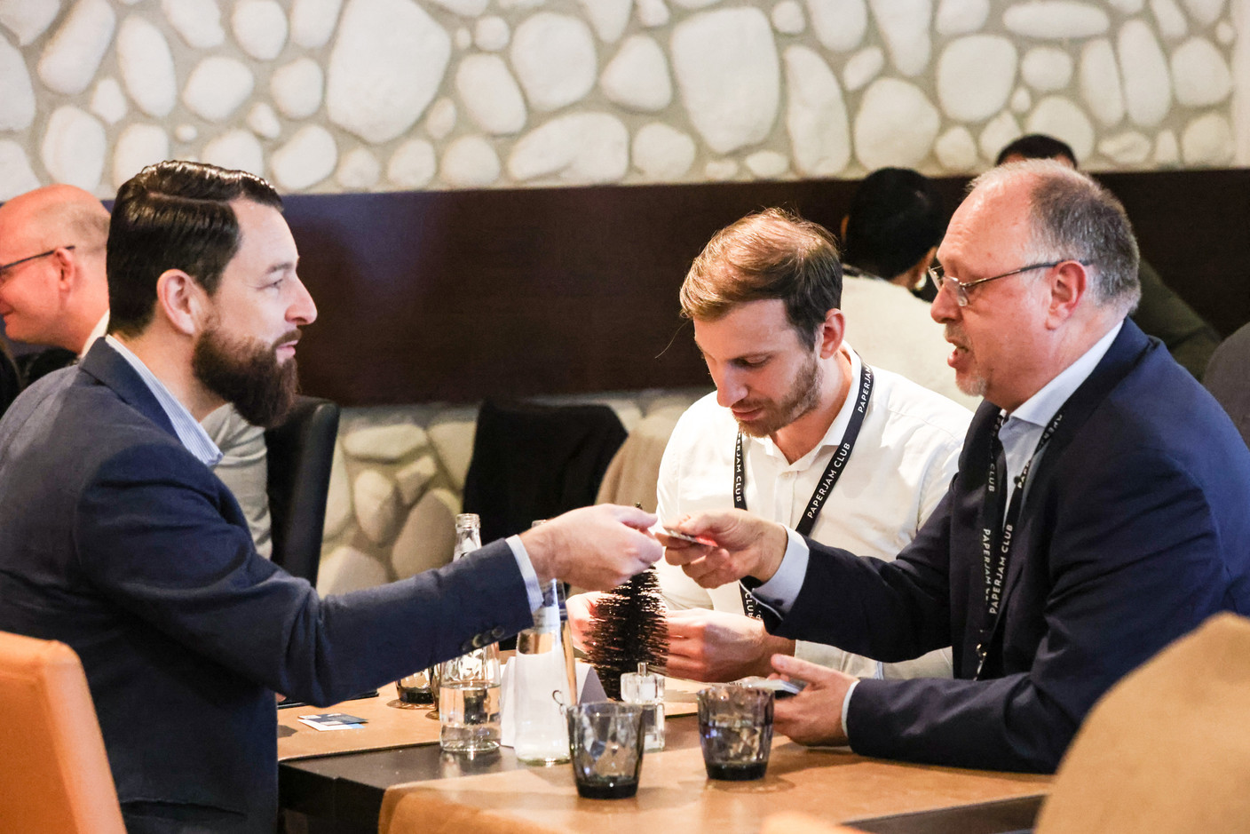 Alexandre Lemaire (Buro Partner Luxembourg), Jordan Gillet (Pictet & Cie) and Michel Goret (CK - Charles Kieffer Group) at the carrousel lunch organised by the Paperjam+Delano Business Club on Friday 1 December 2023 at the Bivius restaurant. Photo: Marie Russillo / Maison Moderne