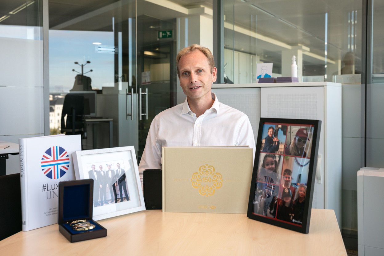 Niccolo Polli, CEO of HSBC in Luxembourg, is seen sitting at the meeting table in his office with 6 items that adorned his workspace when Delano visited in mid-October. Photo credit: Romain Gamba