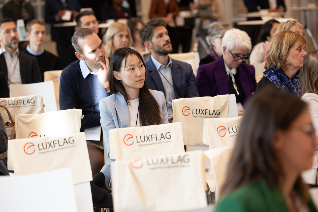 The Luxembourg Finance Labelling Agency (Luxflag) said 12 new investment products received one of its labels during the third quarter of 2024. Library picture: Attendees at a Luxflag conference in October 2023. Photo: Guy Wolff/Maison Moderne