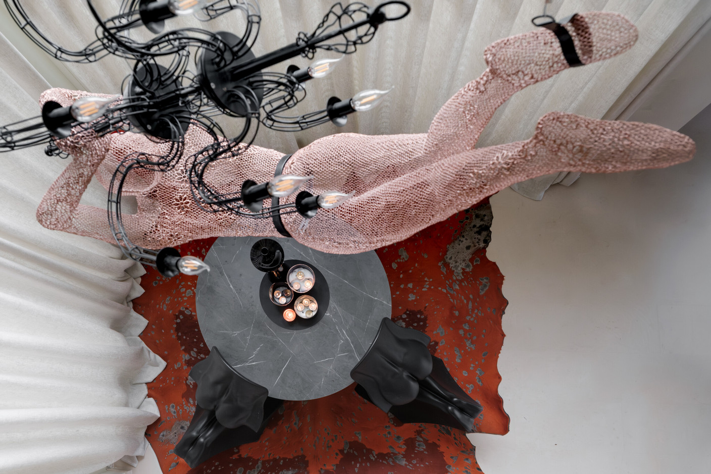 The mermaid lamp, created by an Indonesian artist, was unearthed in Milan. For a striking effect, it hangs above a pair of Her & Him chairs by Fabio Novembre. Photo: Patricia Pitsch/Paperjam