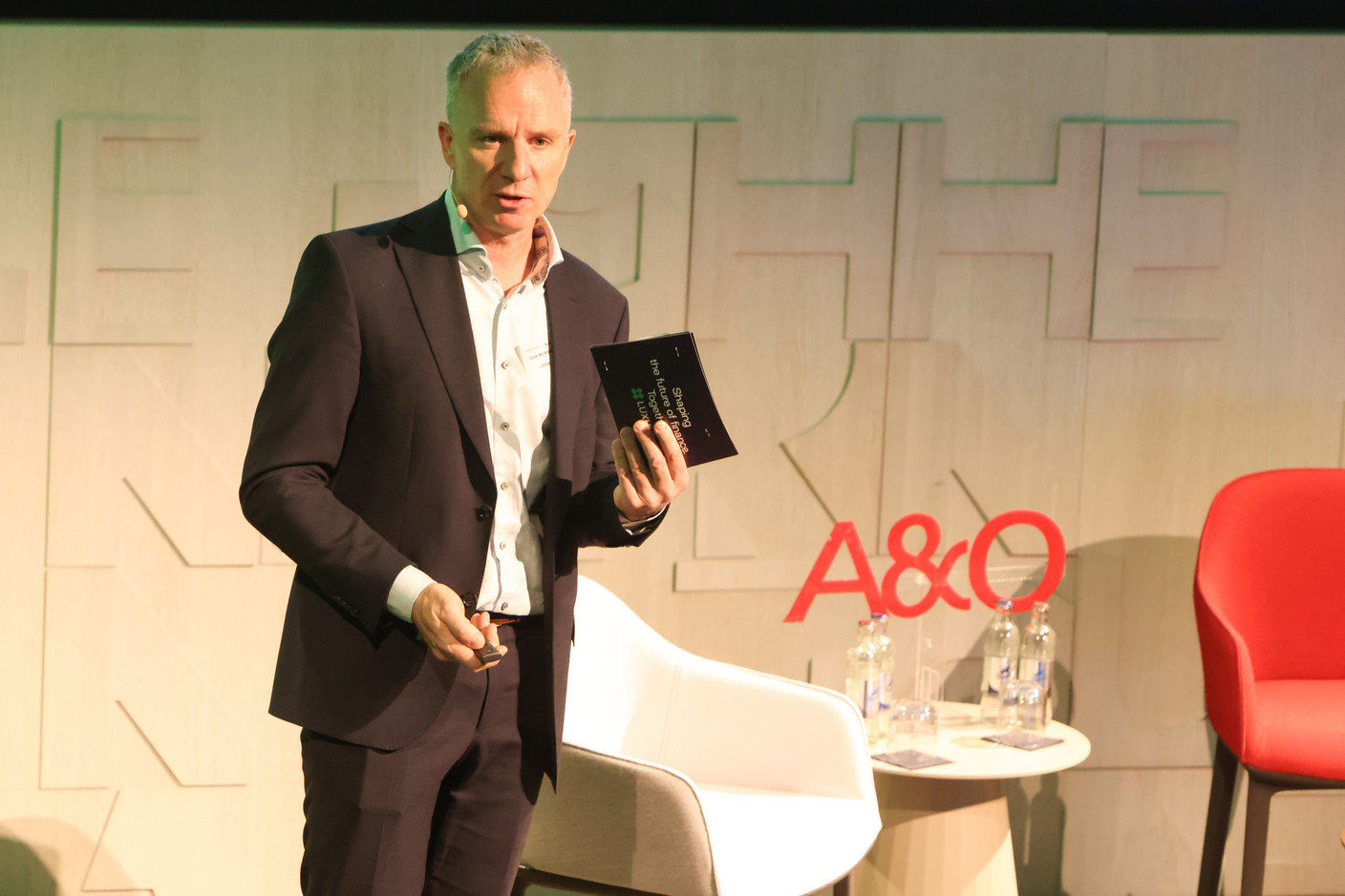 Claude Meurisse (Luxhub) spoke during a panel on instant payments during an Allen & Overy and Luxhub event on payments regulation, 18 April 2024. Photo: Marie Russillo/Maison Moderne