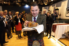 Stuart Cassells serves haggis at Abrdn’s “Outlook 2024 and Scottish Heritage Night,” 22 February 2024. Photo: Guy Wolff/Maison Moderne
