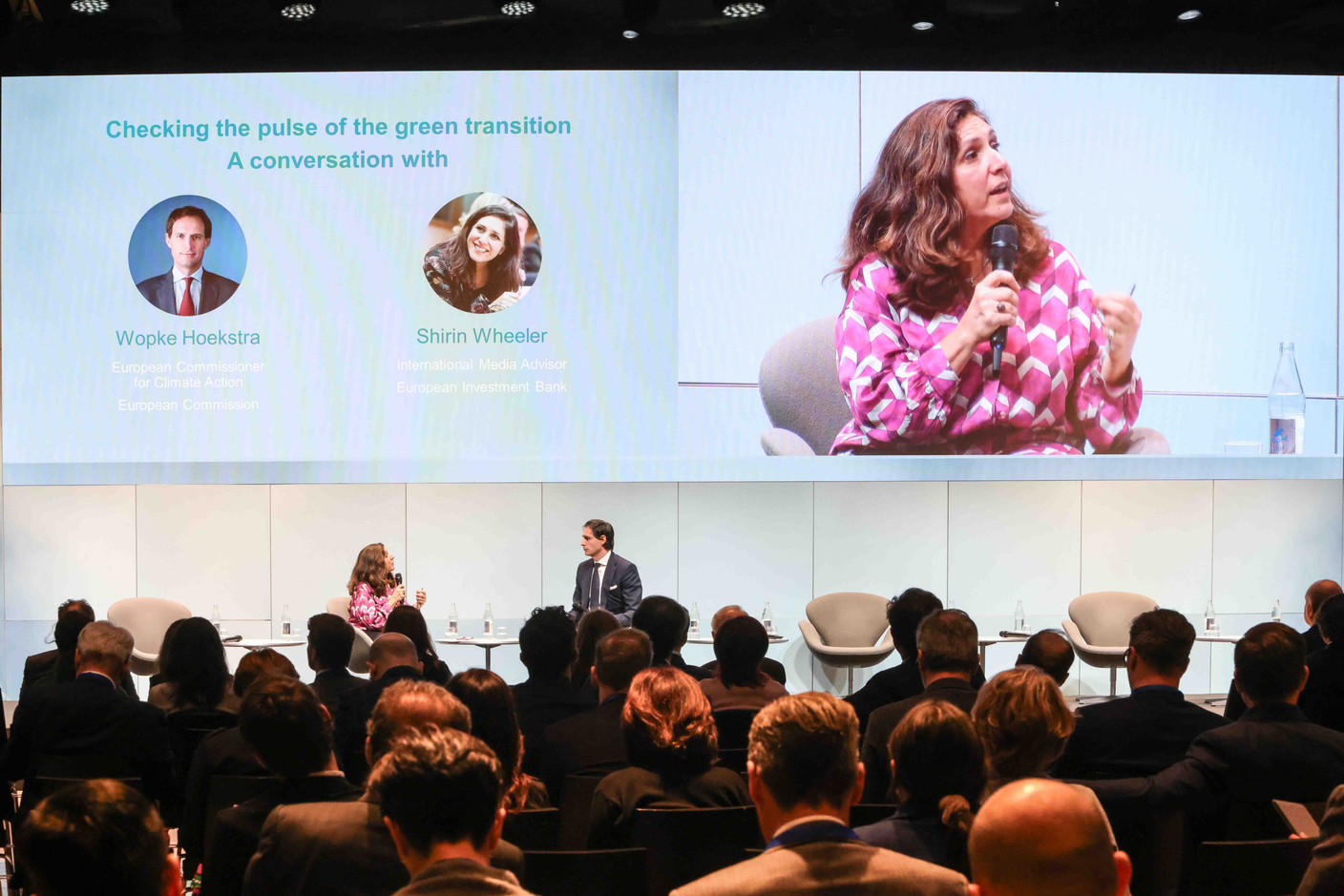 Shirin Wheeler, principal advisor, international communications and partnerships at the European Investment Bank, and Wopke Hoekstra, European climate action commissioner, during the “Fireside chat: Checking the pulse of the green transition” at the EIB Group Forum, 8 February 2024. Photo: Marie Russillo/Maison Moderne