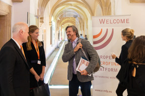 Participants arriving at Neumünster Abbey for the opening day of European Microfinance Week, 15 November 2023. Annelotte Jens (FMO, Dutch entrepreneurial development bank) on the left. Photo: Romain Gamba / Maison Moderne