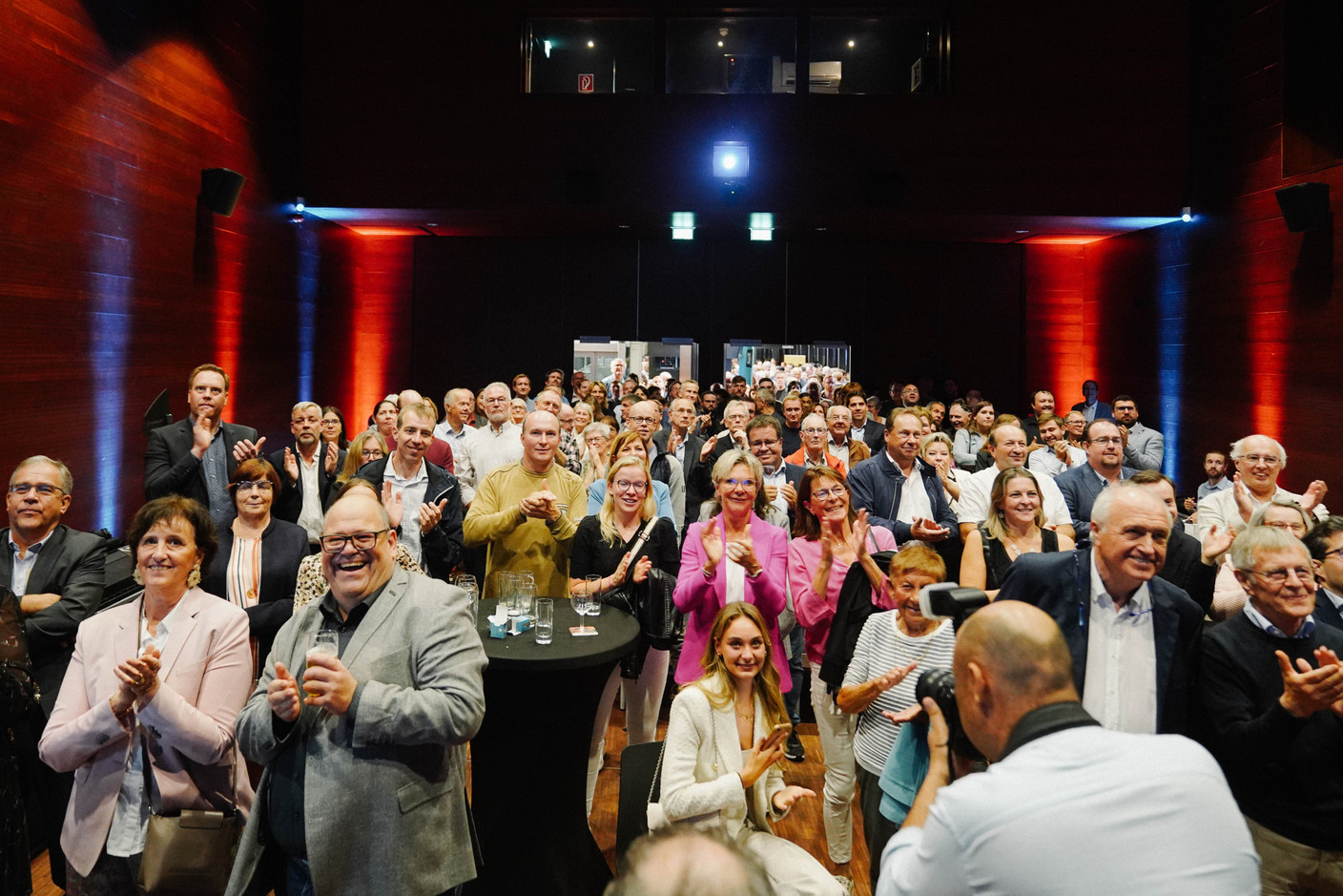 CSV supports watch voting results come in at the party’s election night HQ, held at the A Schommesch community centre in Niederanven, 8 October 2023. Photo: Morris Kemp/Maison Moderne