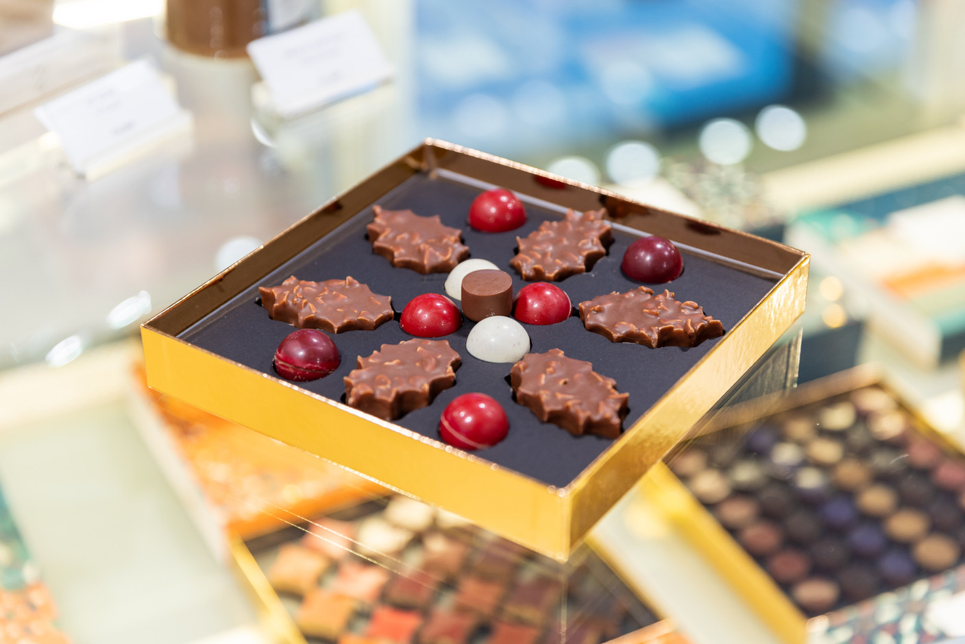 The malline bouchées de houx, containing six bites of holly with cashew nuts, eight grelots with woodland pralines and a twist. Holly was a strong inspiration for the winter collection for Pierre Marcolini.  (Photo: Romain Gamba/Maison Moderne)