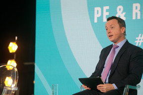 Robert White, partner at EY, is seen moderating the “Investing in Infrastructure” panel during Alfi’s PE & RE conference, 1 December 2021. Photo: Matic Zorman