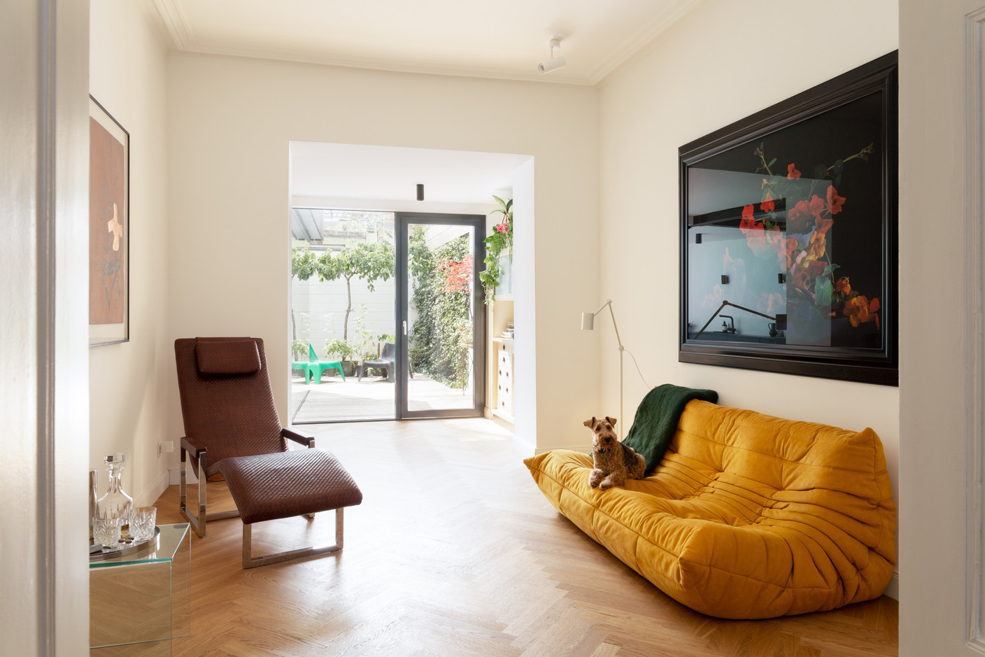The living room benefits from a generous influx of natural light. Photo: Patty Neu