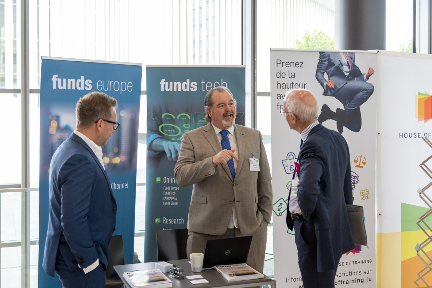 David Wright of Funds Europe is seen speaking with Alfi deputy director general Marc-André Bechet. Photo: Romain Gamba/Maison Moderne