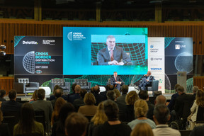 Claude Marx, director general of the Luxembourg Financial Sector Supervisory Commission (CSSF), and Lou Kiesch, partner at Deloitte in Luxembourg, seen speaking at the Cross-Border Distribution Conference, 25 May 2023. Photo: Romain Gamba