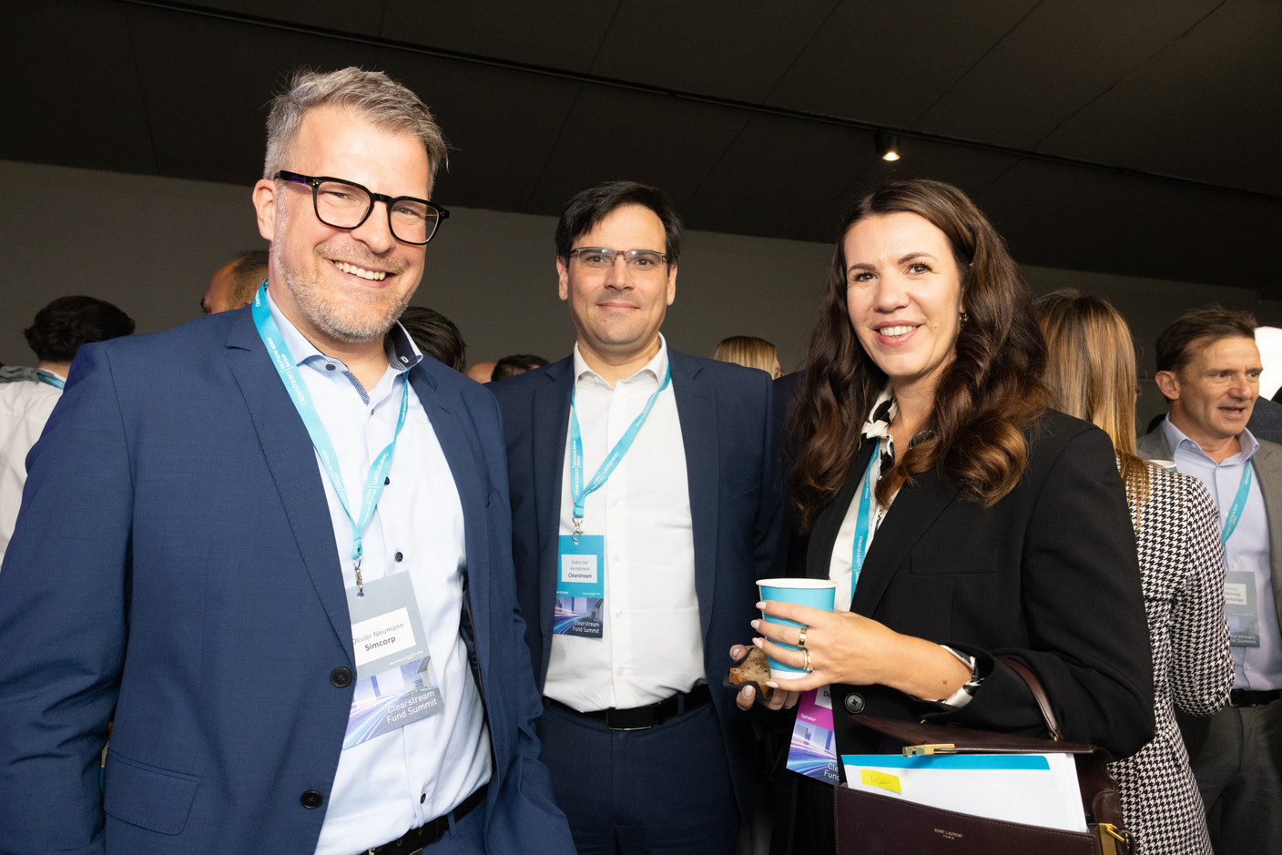 Olivier Neumann (Simcorp), Cedric Van Kerrebroeck (Clearstream), Lisa Lynn König (Clearstream) at the Clearstream Fund Summit, Kirchberg Kinepolis, 10 October 2024. Photo: Eva Krins/Maison Moderne