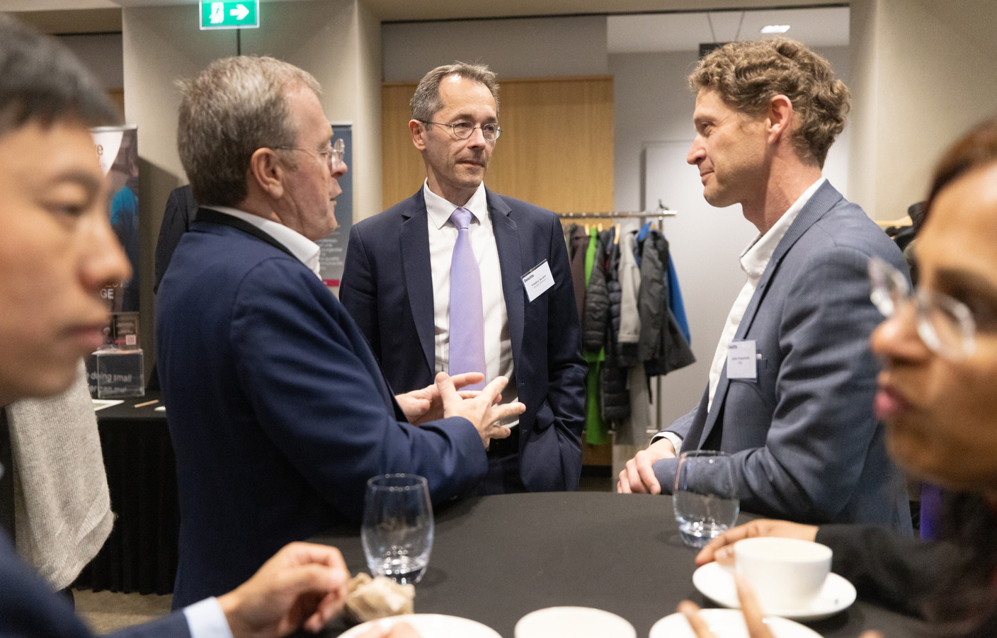 Participants at Deloitte’s sustainable finance conference had the opportunity to network. Frédéric Surdon (Société Générale) in the centre and Julien Froumouth (ABBL) on the right) Photo: Guy Wolff/Maison Moderne